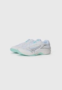 White athletic shoes with a smooth texture, light blue accents, silver detailing, and a curved mint green sole.