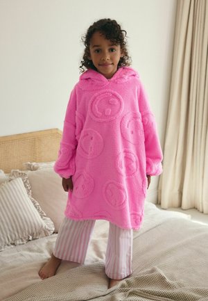 Roze fleece poncho met patronen van vrolijke gezichten, capuchon en oversized mouwen. Gepaard met gestreepte pyjamabroek. Zacht, gestructureerde stof.
