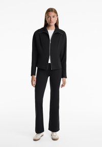 OYSHO NEOPRENE-EFFECT RISE FLARE  - Hlače - black