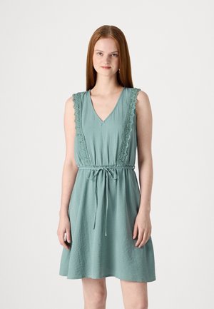 Light teal sleeveless dress with a V-neck, lace detailing along the shoulders, and a drawstring waist. Soft, textured fabric.