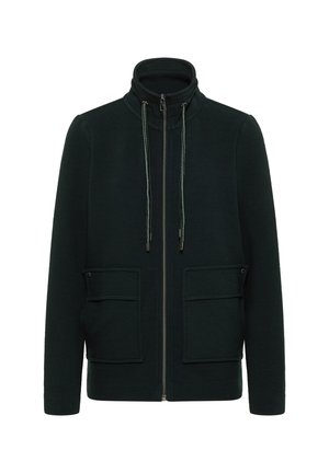 Mørkegrøn zip-up jakke med høj krave, to frontlommer og tekstureret stof. Inkluderer justerbar snor med metalliske ender.