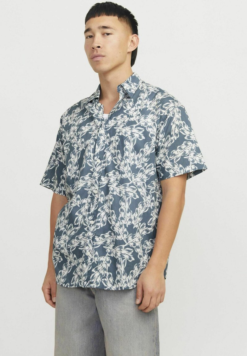 Kurzärmliges Hemd mit Knöpfen in Marineblau und weißem Blumenmuster, aus leichtem Stoff mit entspannter Passform und mit Kragen.