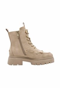 Botte beige à tige haute avec lacets, fermeture éclair latérale, semelle épaisse et franges décoratives à l'avant, présentée sur fond blanc.