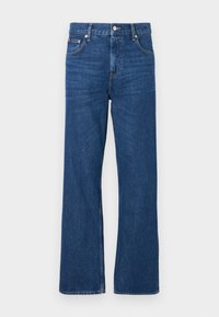 Blauwe spijkerbroeken met een wijd uitlopende pasvorm, voorzien van een klassieke knoop- en ritssluiting, en vijf zakken. Kenmerkende vervaagde textuur over de hele broek.