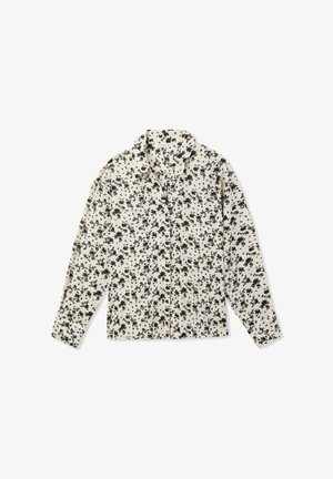 Blusa floreale in crema con motivo floreale nero, maniche lunghe e colletto classico. Tessuto leggero, chiusura con bottoni davanti e vestibilità comoda.