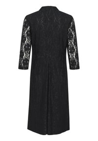 Manteau en dentelle noire avec des manches trois quarts, présentant un motif floral et une silhouette droite, fermé par une fermeture éclair au dos.
