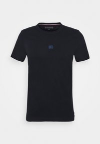 Black cotton t-shirt with a round neckline, short sleeves, and a small blue logo accent on the front. Smooth texture, regular fit.
