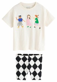 Kortärmad krämfärgad T-shirt med färgglada tecknade flickor och leggings med svart-vitt diamantmönster. Blandning av bomull, avslappnad passform.