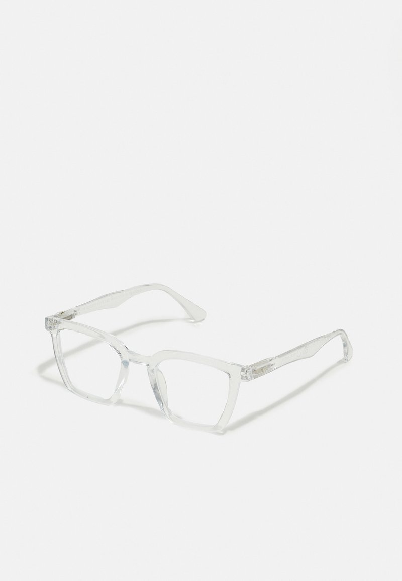Průhledné obdélníkové brýle s transparentními obrubami a rovnými nohami. Obsahují jemné detaily na spáncích. Lehký design.
