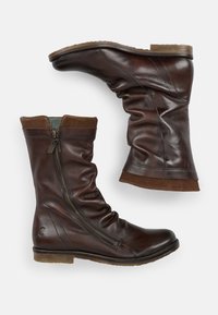 Brown leather ankle boots with a wrinkled design, side zipper, tan suede accents at the cuff, and flat rubber sole.