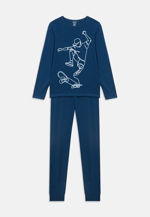Navy blue long-sleeve top and pants set with white line art of a skateboarder performing a trick on the front of the top.