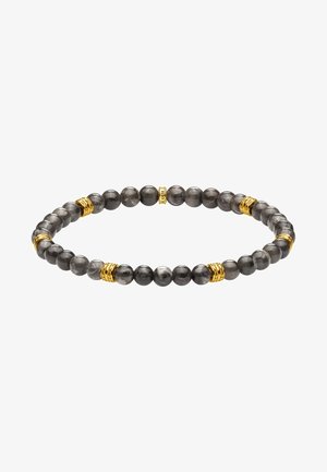 Bracelet extensible avec des perles gris foncé polies et de petits anneaux dorés répartis uniformément autour du cercle.