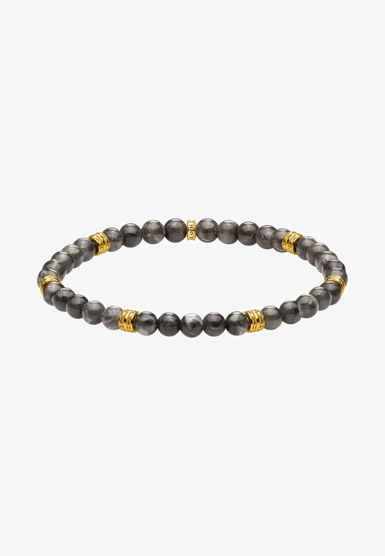 Bracelet extensible avec des perles gris foncé polies et de petits anneaux dorés répartis uniformément autour du cercle.