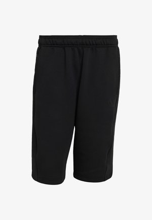 Černé sportovní šortky vyrobené z měkké, elastické látky. Mají elastický pas, boční kapsy a nenápadné logo na dolní levé noze.