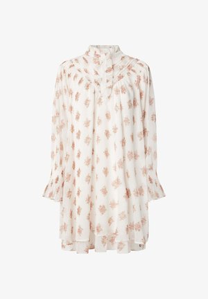 Valge pluus lillemustriga roosa ja oranži värviga. Omab kõrget kaelust, pikki varrukaid ja frillidest detaile. Kerge kangas.