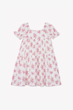 Biele bavlnené šaty s vypuklými krátkymi rukávmi, štvorecovým výstrihom a rozšírenou sukňou. Po celom obvode sú posiate ružovými kvetinovými vzormi.