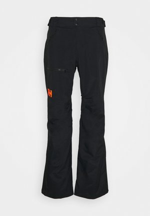 Pantalones de esquí negros hechos de material resistente al agua, con un bolsillo con cremallera y un acento del logo en naranja. Diseño de pierna recta con textura duradera.