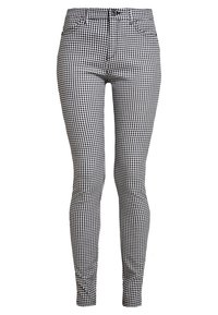 Černobílé kostkované skinny džíny se zapínáním na knoflík, poutky na opasek a klasickým pětipocket designem. Hladká tkanina s přiléhavým střihem.