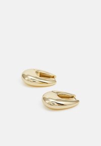 Gold hoop earrings with a smooth, rounded design and a clasp at the back. The surface is reflective, enhancing their metallic finish.