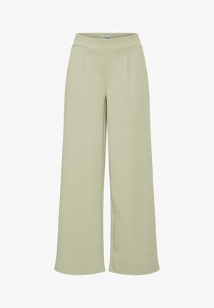Ljust gröna vida byxor med en mjuk textur, hög midja och två framfältsveck, tillverkade av ett mjukt tyg för komfort.