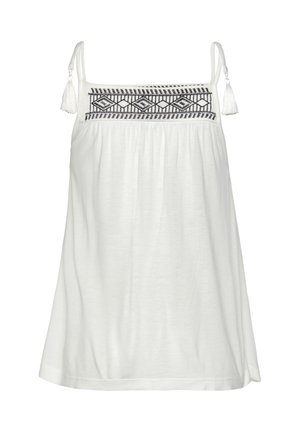 Valge ilma varrukateta pluus, millel on must tikitud geomeetriline muster rinnal, kohandatavad rihmad ja lipsu aktsendid. Pehme kangas, lõdva istumisega.