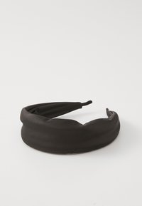 Black fabric headband with a smooth texture, rounded shape, and gathered detailing; flexible ends for easy wear.