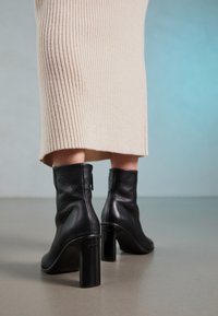 High heeled ankle boots - black