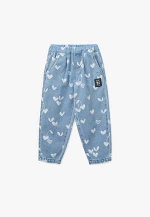 Light blue denim trousers with white heart and cherry patterns, elastic waistband, and side pockets. Features a small brand label on the front.