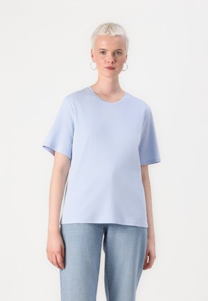 Light blue t-shirt with a round neckline and short sleeves. Features subtle embroidered logo at the chest. Soft fabric and relaxed fit.