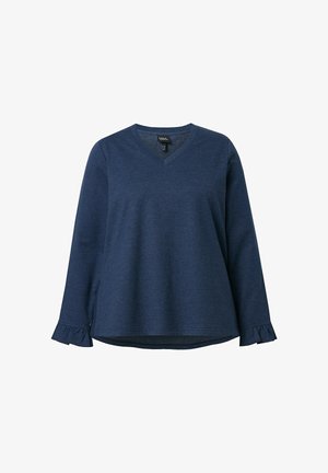 Lauluhihainen tummansininen paita, jossa on V-pääntie. Hihansuissa on röyhelökoristeet ja rento leikkaus, valmistettu pehmeästä, teksturoidusta kankaasta.