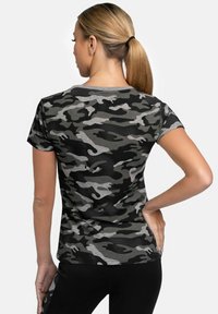 Black and gray camouflage short-sleeve shirt with a fitted design. Features a round neckline and textured fabric pattern.