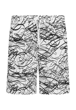 Des maillots de bain noir et blanc présentent un motif de gribouillis chaotique, une taille élastique, un cordon de serrage à l'avant et une texture de tissu lisse.