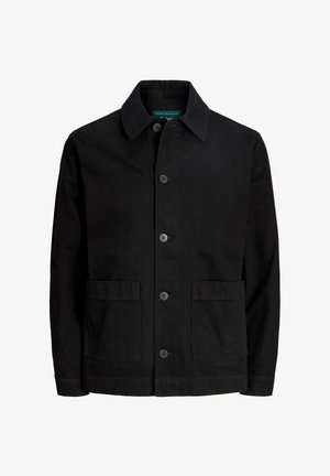 Chaqueta de algodón negra con cuello tipo solapa, cierre frontal de botones y dos bolsillos de parche. Presenta una textura suave y un diseño sencillo y clásico.