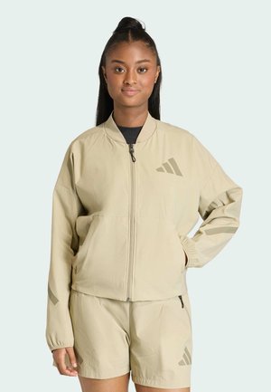 Hellbeige Bomberjacke mit Reißverschluss, elastischen Bündchen und zwei Seitentaschen. Verfügt über ein dezentes Drei-Streifen-Logo auf der linken Brust und an den Ärmeln.