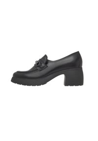 Black leather heeled loafers with a chunky block heel, featuring a decorative buckle on the front and smooth surface texture.