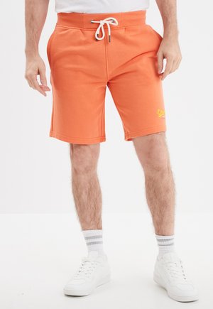Pantalones deportivos - orange