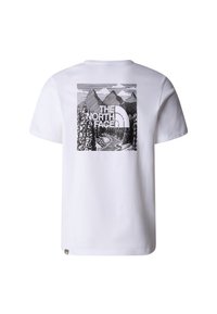 White short-sleeve T-shirt with black graphic of mountains, trees, and a winding path, featuring "The North Face" logo on the back.