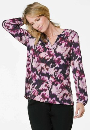 Langärmliges Oberteil in lila, rosa und schwarzem Blumenmuster mit V-Ausschnitt und weicher Textur, ausgestattet mit gerafften Bündchen und fließendem Design.