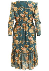 Abito floreale in tessuto teal con maniche lunghe, dettagli arricciati, vita arricciata e orlo a strati. Presenta motivi floreali in rosa e giallo.