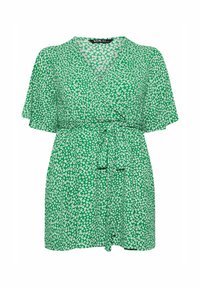 Grön omlottklänning med korta ärmar, prydd med ett blommönster i vitt. Inkluderar ett knytbälte i midjan och en V-ringning.