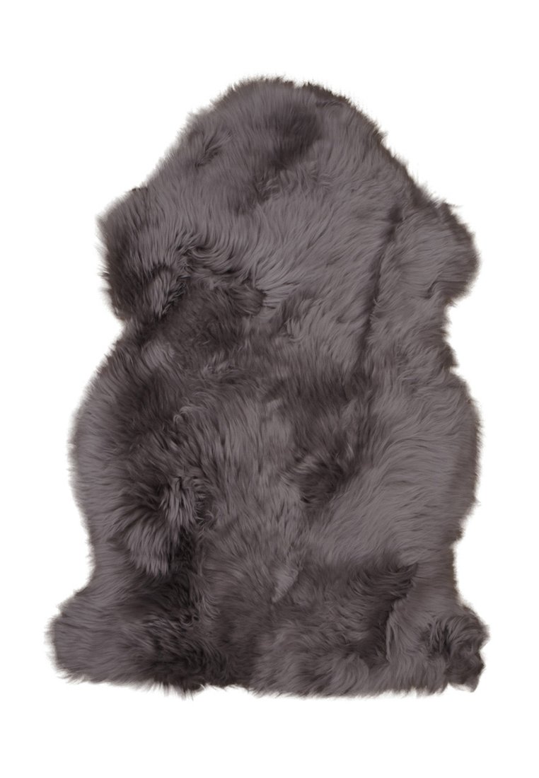 Grijze nepbont vloerkleed met een zachte, pluffige textuur, onregelmatige vorm en variërende poolhoogte, ontworpen voor decoratief of functioneel gebruik.