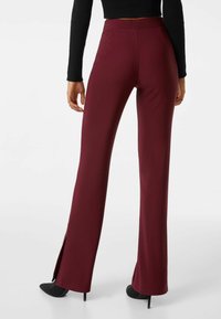 Bershka Tygbyxor - dark red