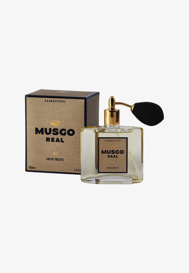 Klarer Glasflakon mit einem goldenen Sprühkopf und schwarzem Pumpspender. Die Box ist braun mit schwarzen Akzenten und trägt den goldenen Schriftzug "MUSGO REAL 1887."