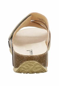 Brown cork-soled sandal with leather-like straps, open back design, and a textured rubber outsole. Smooth footbed surface for comfort.