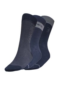 Tres pares de calcetines azul marino: uno con canalé, uno liso y uno con un puño gris. Cada par presenta un sutil logo en el lateral.