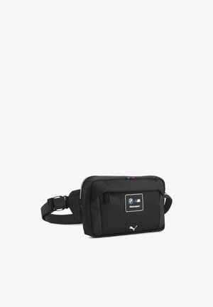 Sac banane noir BMW Motorsport et Puma avec compartiments zippés et sangle ajustable.