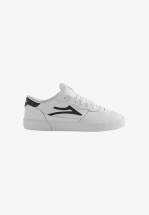 White sneaker with black accents, textured rubber sole, and lace-up design. Features stitched details and a rounded toe shape.
