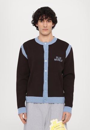 Black and light blue knit cardigan with button front, ribbed cuffs, and pockets. Features "BLUE MARBLE" embroidery on chest.