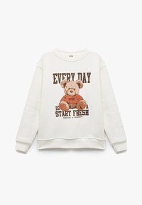 Kremowy sweatshirt z grafiką brązowego misia i napisem, z prążkowanymi mankietami i dołem dla wygodnego dopasowania.