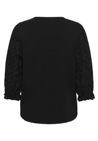 Svart topp med en solid rygg, texturerade spetspuffärmar och en samlad manschett. Tyget är mjukt med intrikata blommönster.
